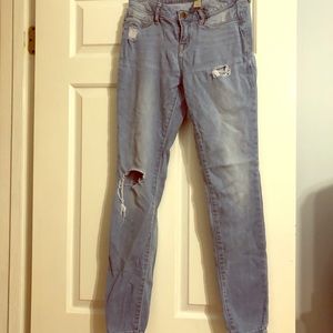 Lightly distressed light denim jegging